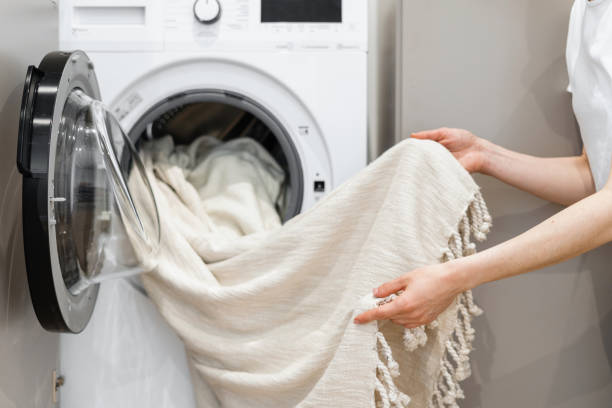 Unloading Laundry From a Washing Machine